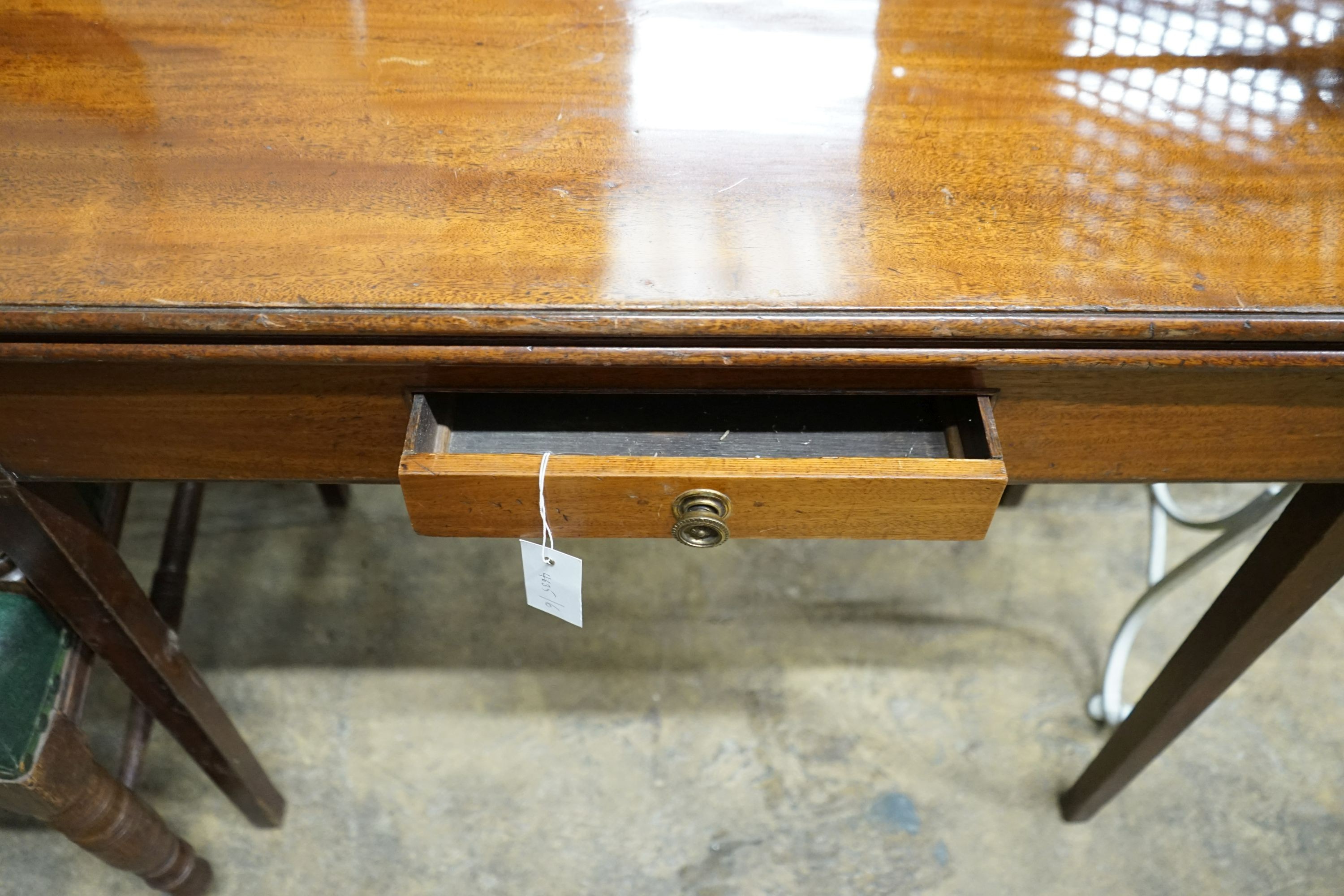 A George III rectangular mahogany folding tea table, width 91cm, depth 44cm, height 76cm